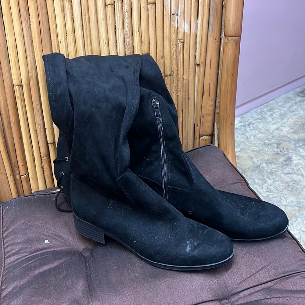 Black Knee high half inch wedged boots.